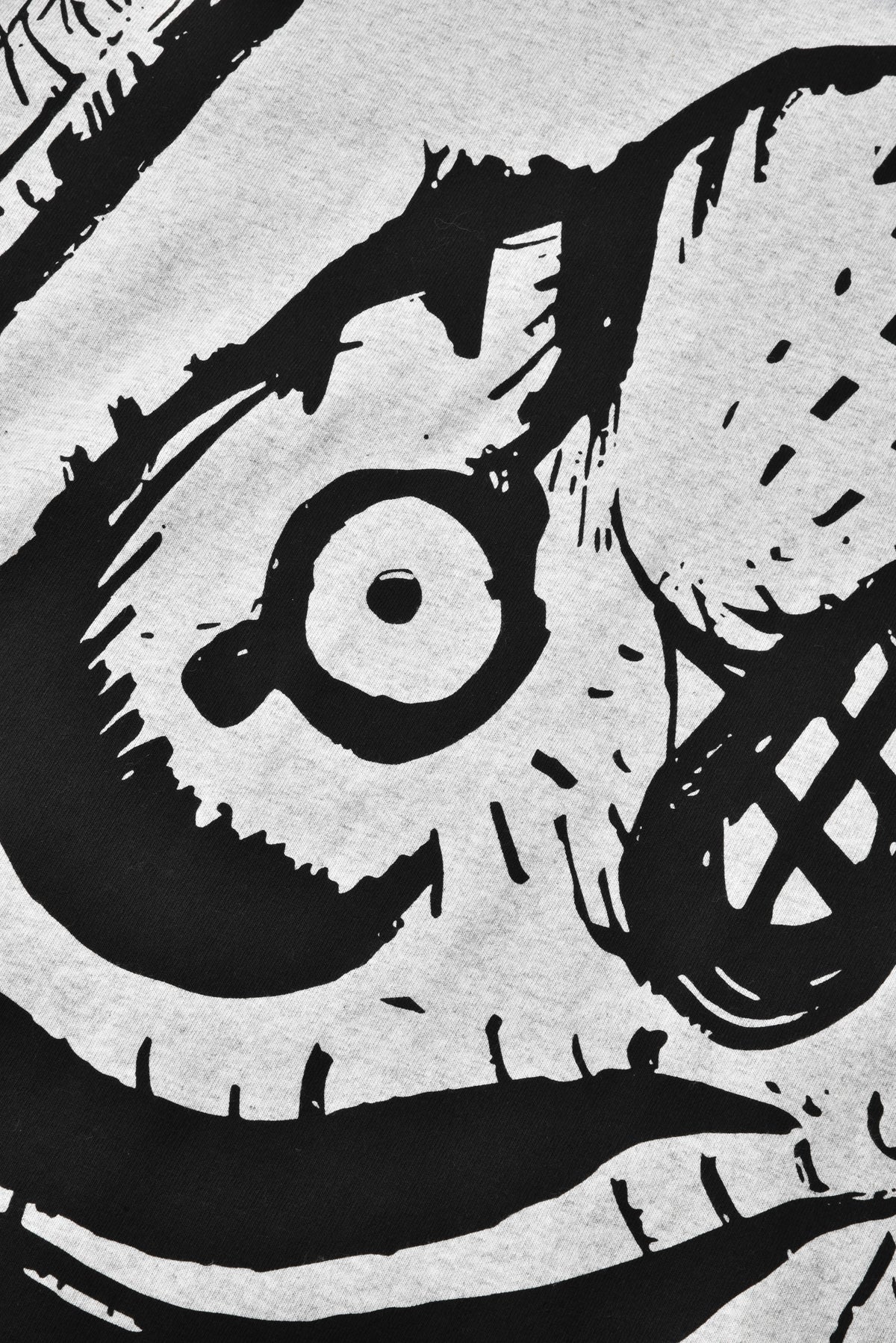 Black and white illustration of a face with large eyes and a mouth.