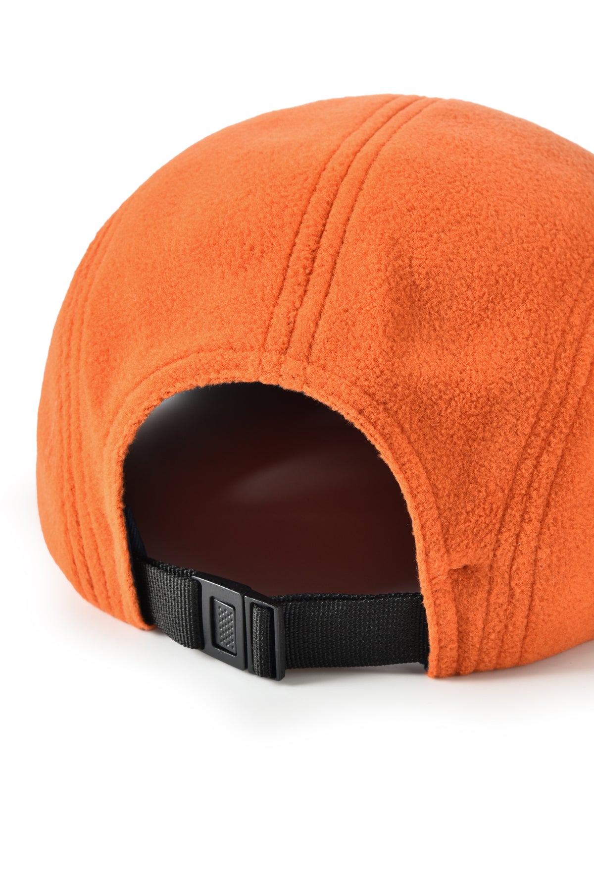 Orange cap with a black strap on a white background