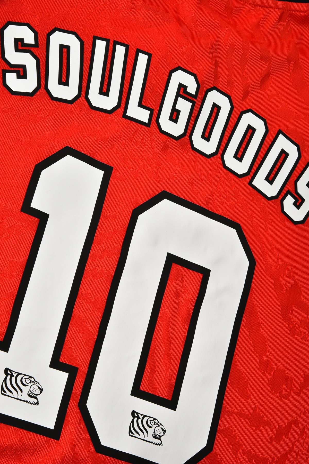 Red jersey with 'Soulgoods' and number '10' on a red background