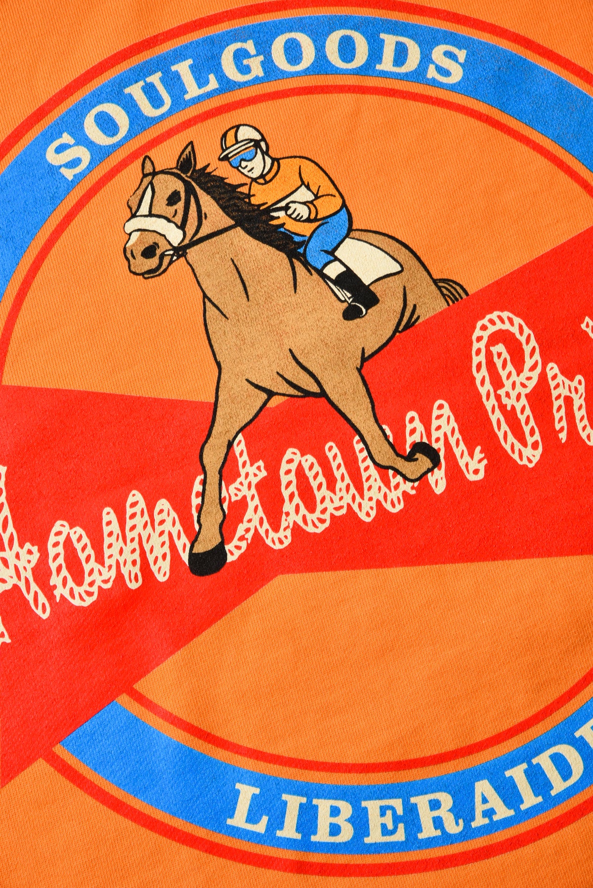 Soulgoods logo with a horse and jockey on an orange background