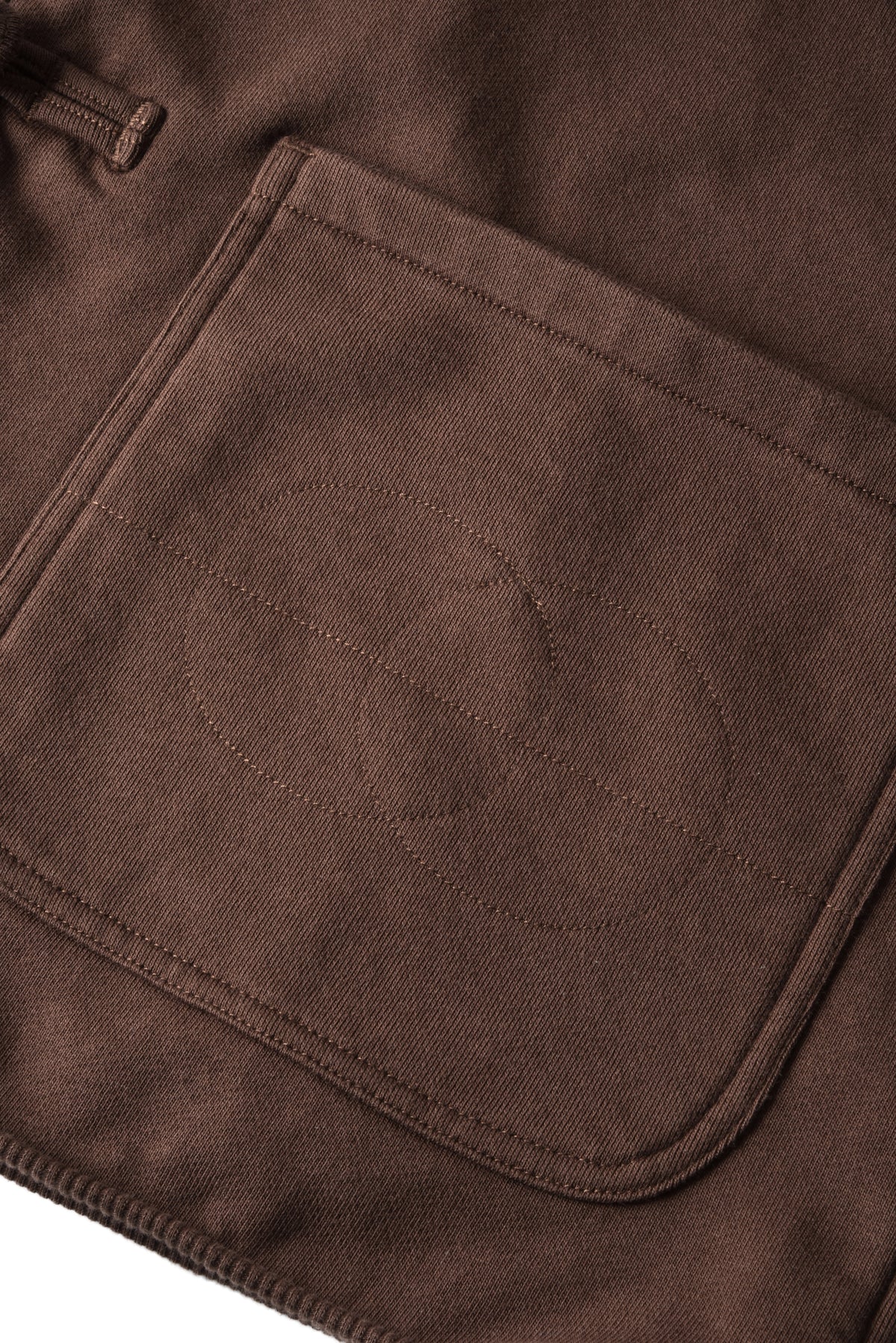 Close-up of a brown fabric pocket on a garment