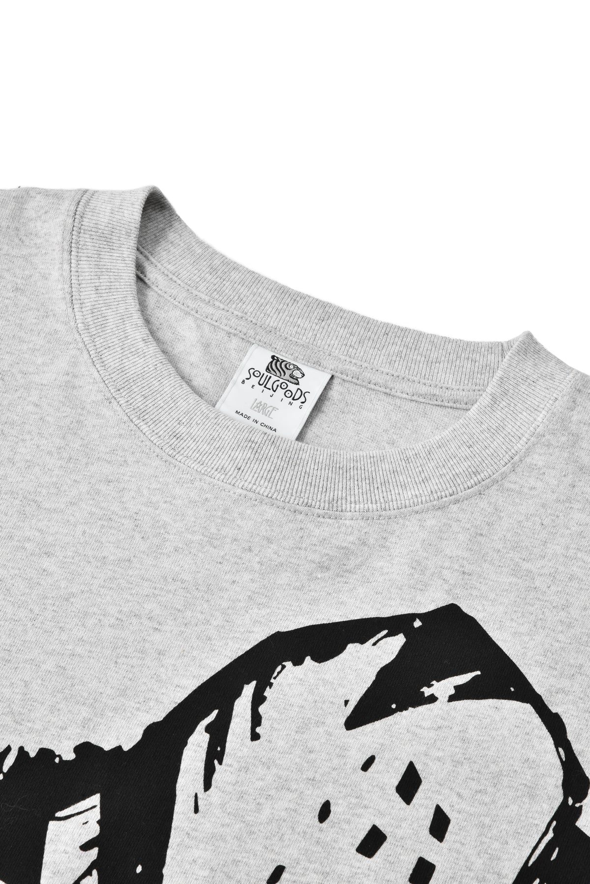 Gray sweatshirt with black graphic design and visible brand label on a white background