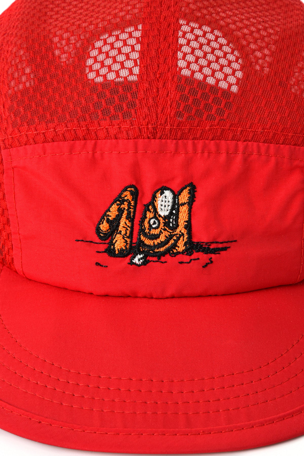 Red cap with a tiger design on a white background