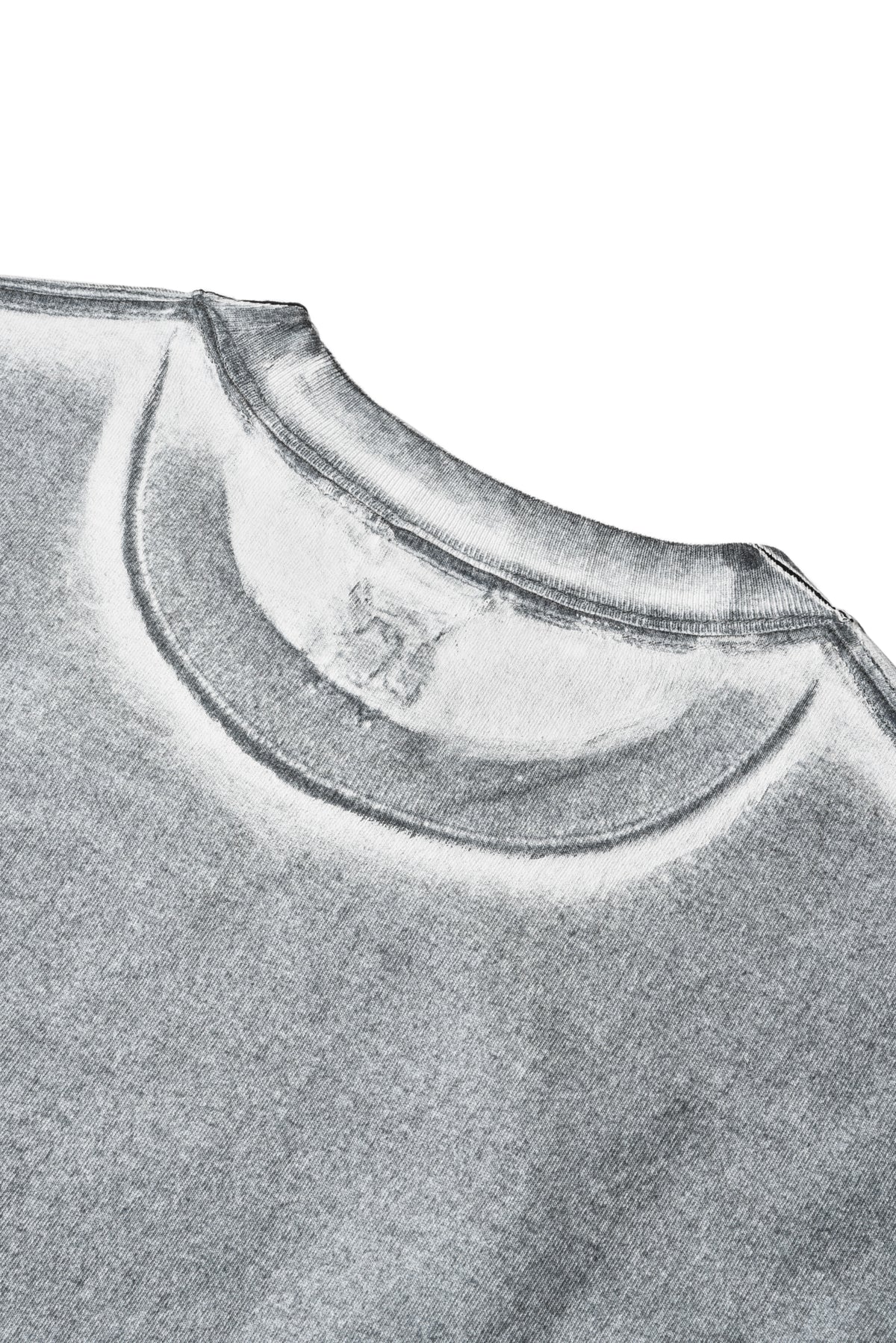 Close-up of a gray garment with a brand logo on a white background