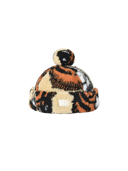 Patterned beanie with pom-pom on a white background