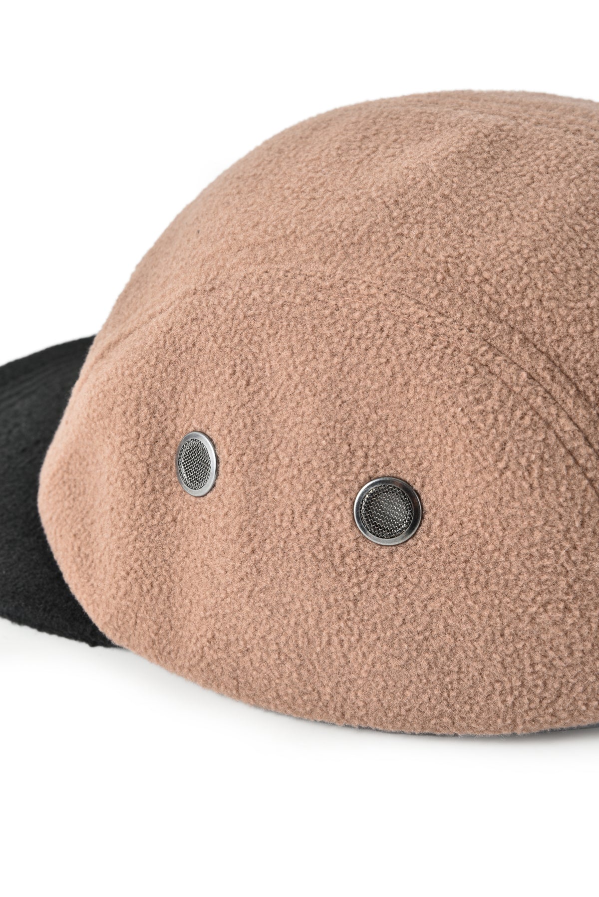 Close-up of a beige fleece-lined cap with black visor on a white background