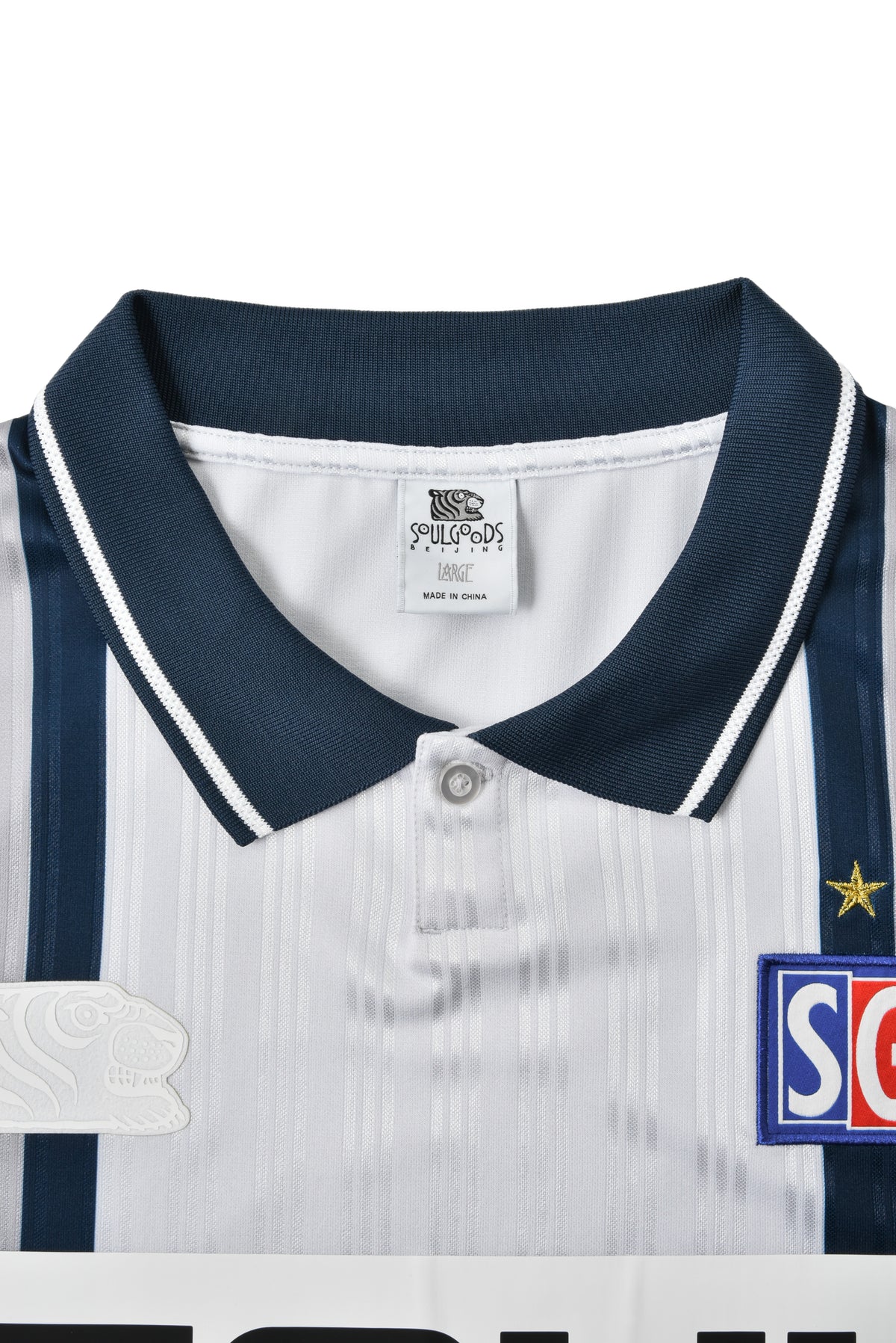 Close-up of a sports jersey with a SOULGOODS brand logo on a white background