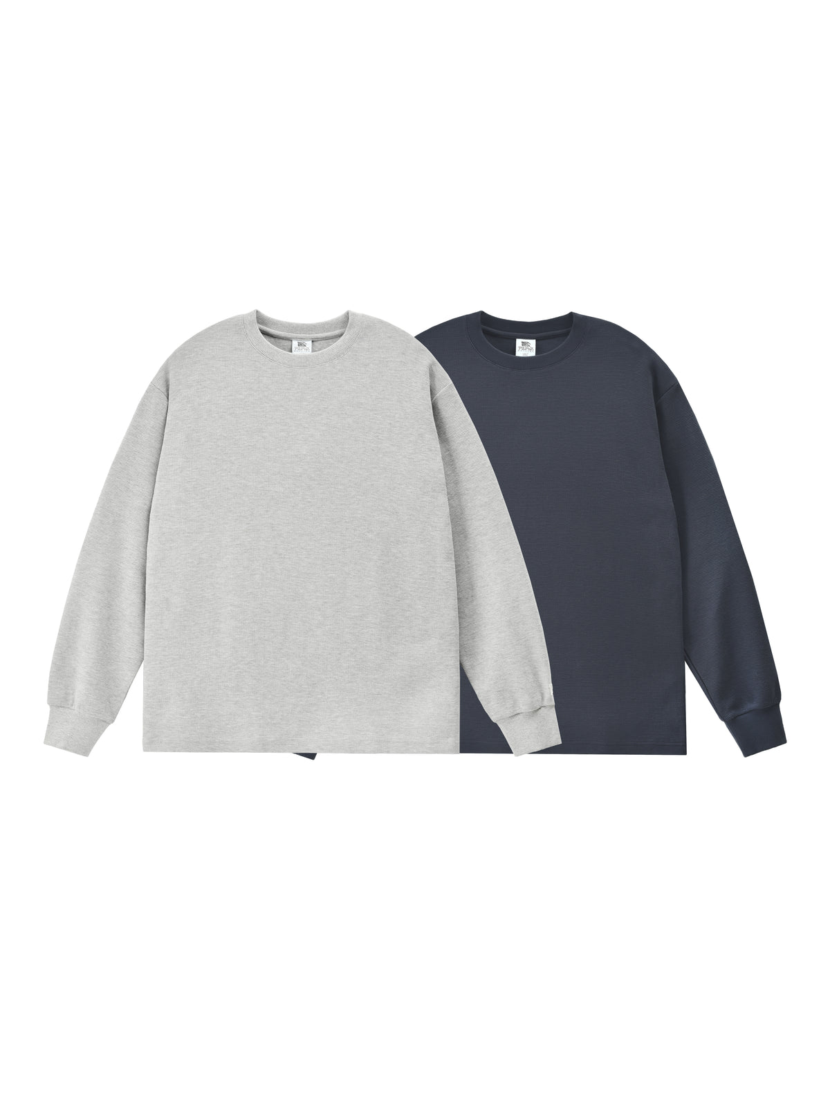 Two sweatshirts, one gray and one navy, on a white background