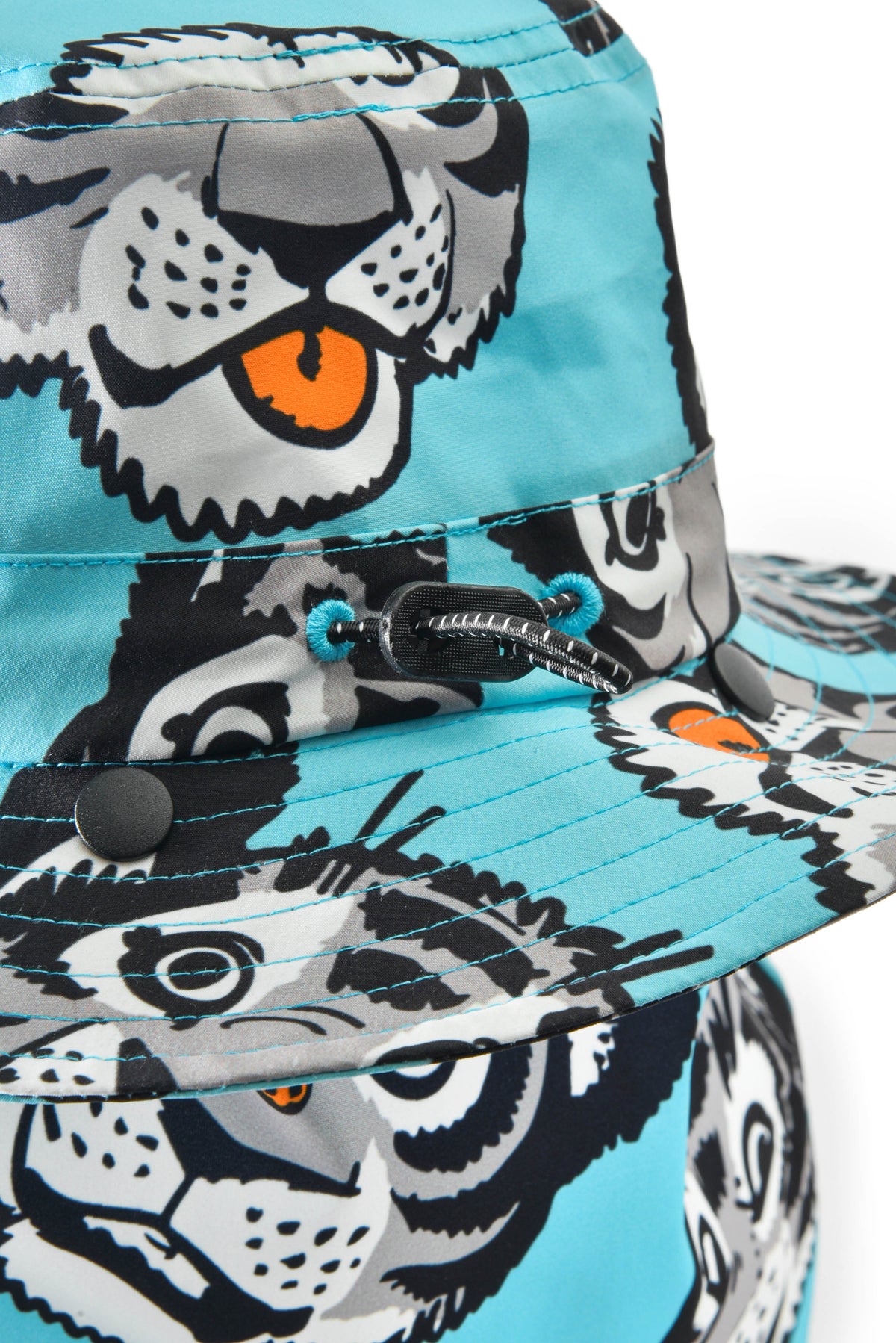 Bucket hat with cartoon tiger pattern on a blue background