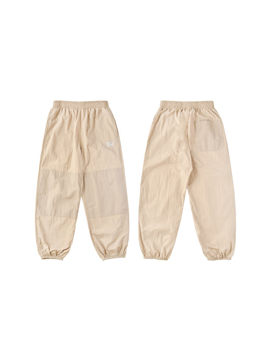 Pair of beige pants on a white background