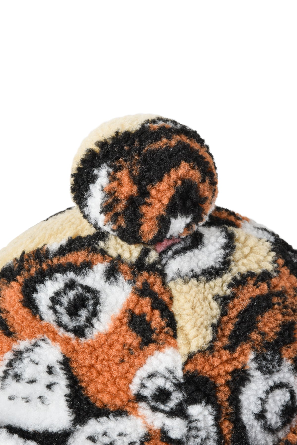 Close-up of a plush toy with a tiger pattern on a white background