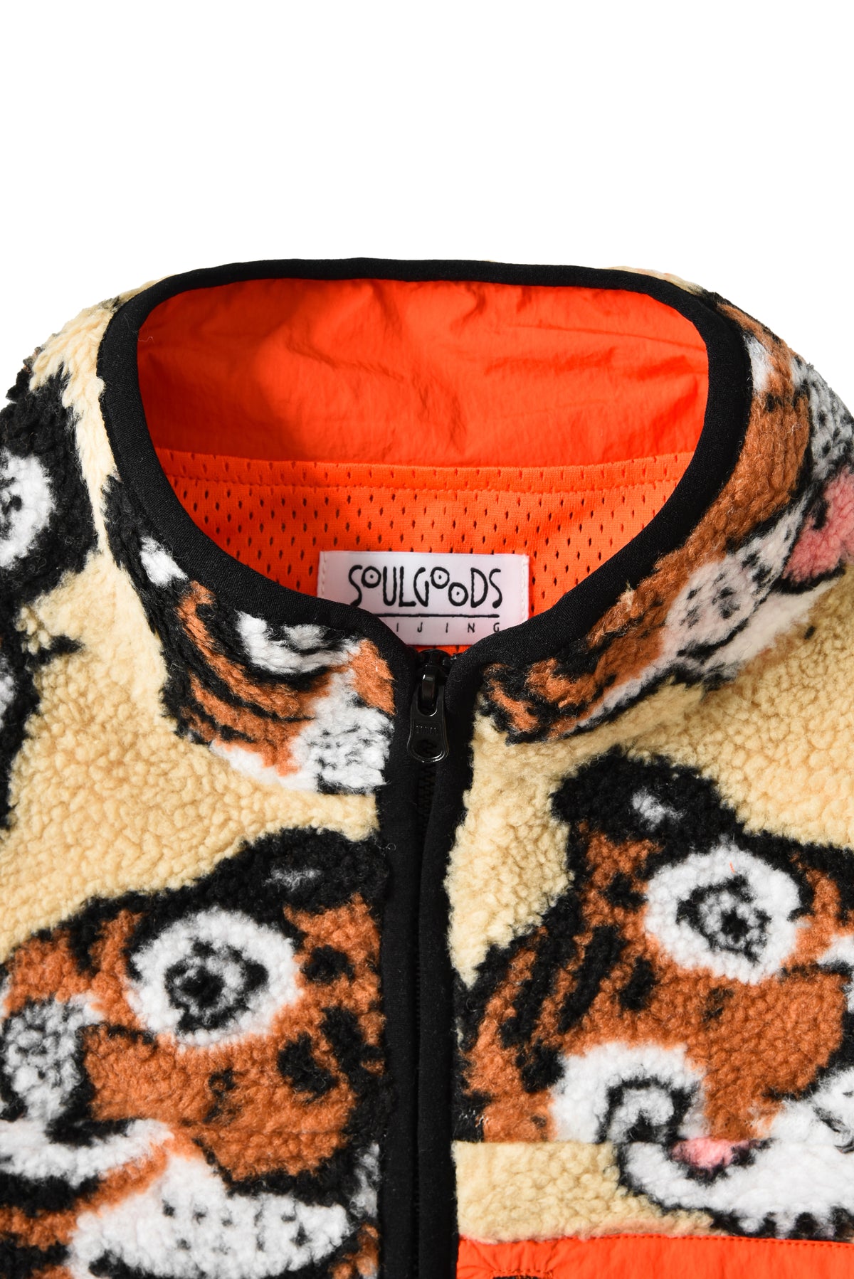 Fuzzy jacket with tiger pattern and orange interior, featuring the brand 'SOULGOODS'.