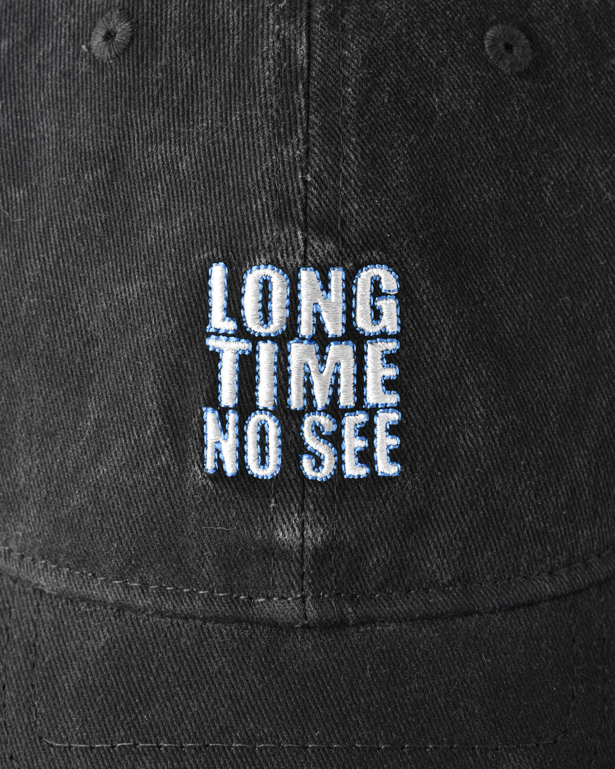 Black cap with 'LONG TIME NO SEE' text embroidered on it