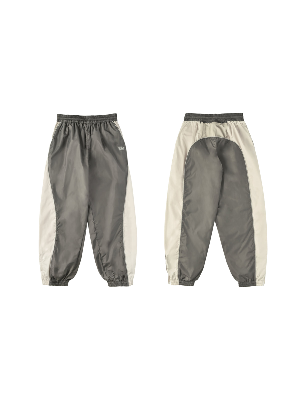 Pair of gray and beige pants with a small soulgoods tiger head logo on a white background