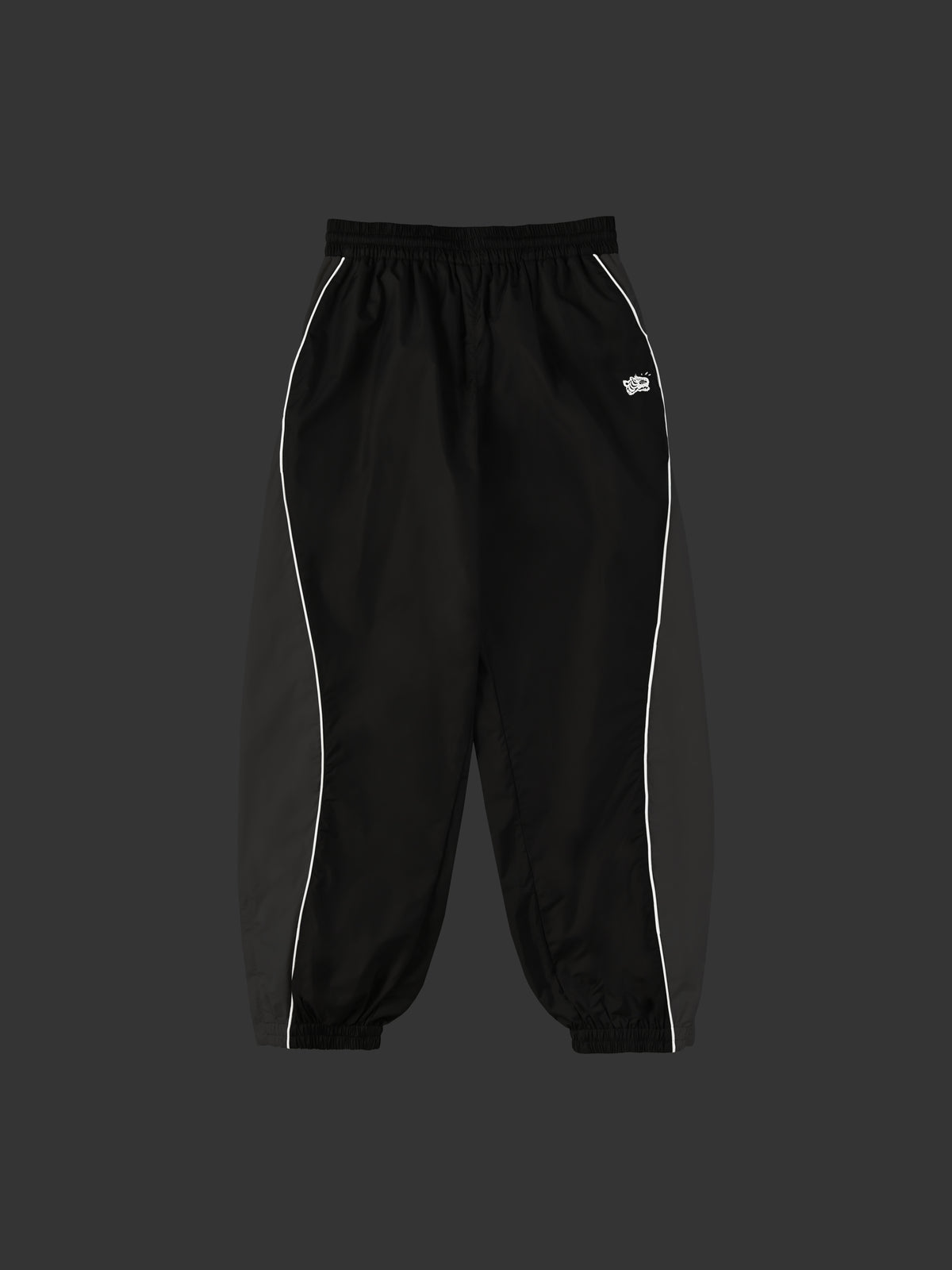 Night glow Black pants with white piping on a dark background