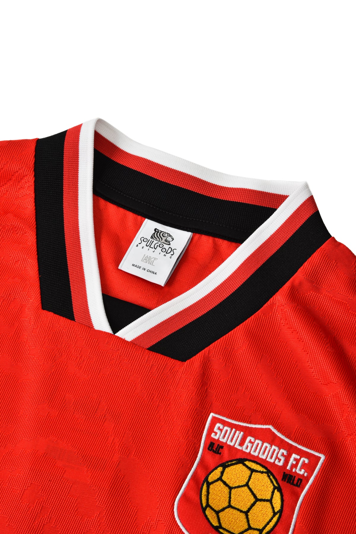 Red sports jersey with 'Soulgoods FC' logo on a white background