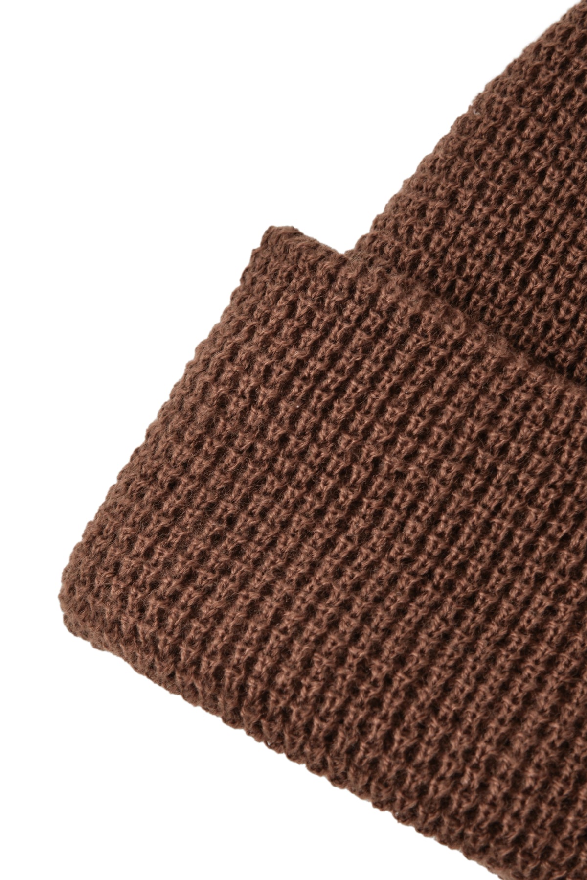 Close-up of a brown knitted fabric on a white background