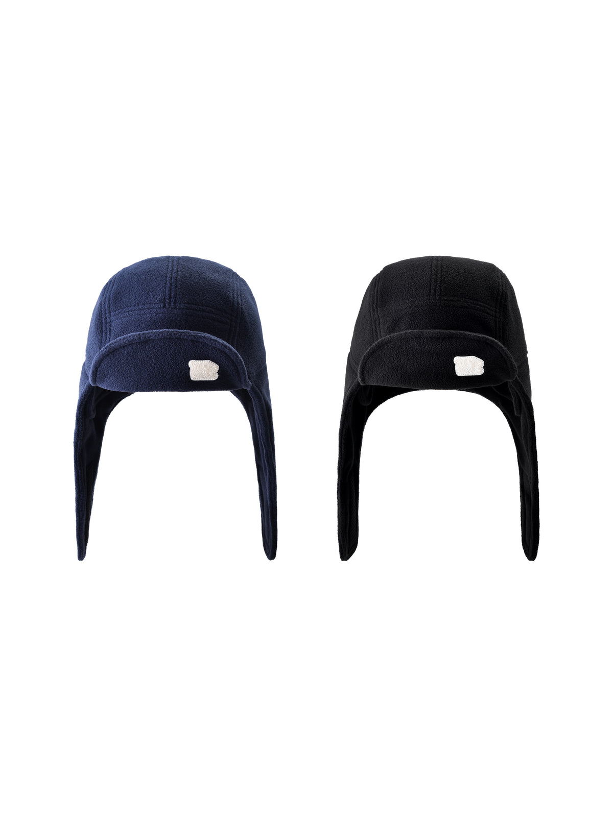 Two beanies, one navy and one black, on a white background