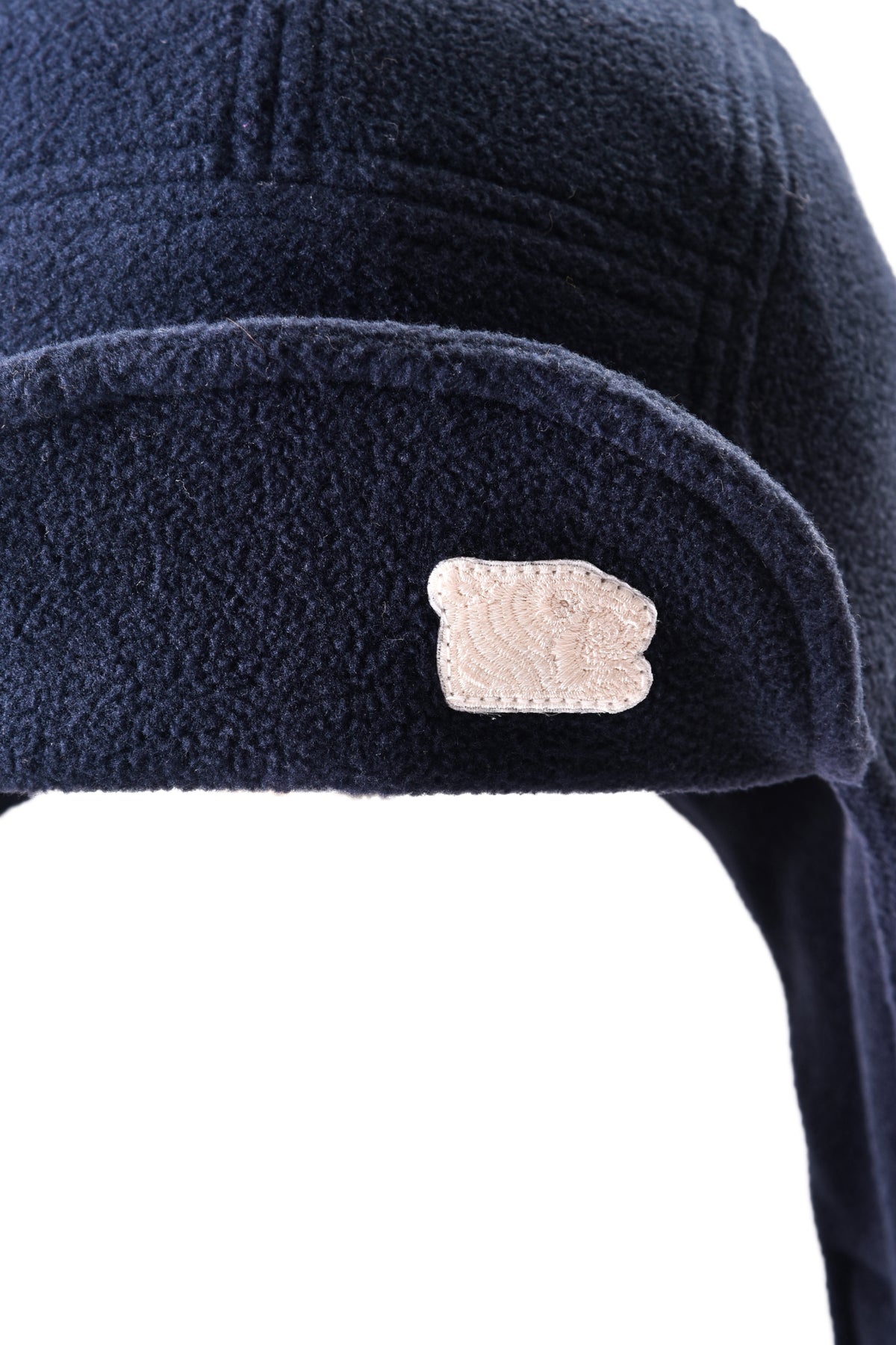 Navy blue fleece-lined cap with a soulgoods tiger head brand logo on a white background