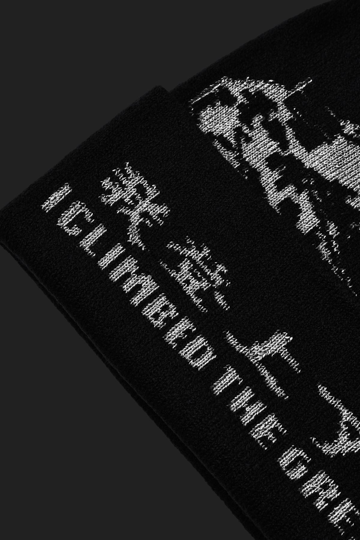 Black and white graphic The Great Wall design on a black background with text.