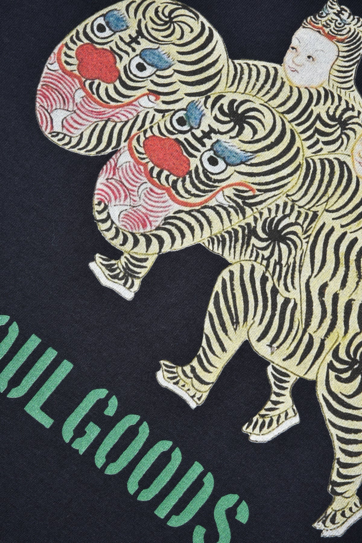Illustration of a person riding a tiger with colorful details on a dark background, featuring the brand 'Soul Goods'.