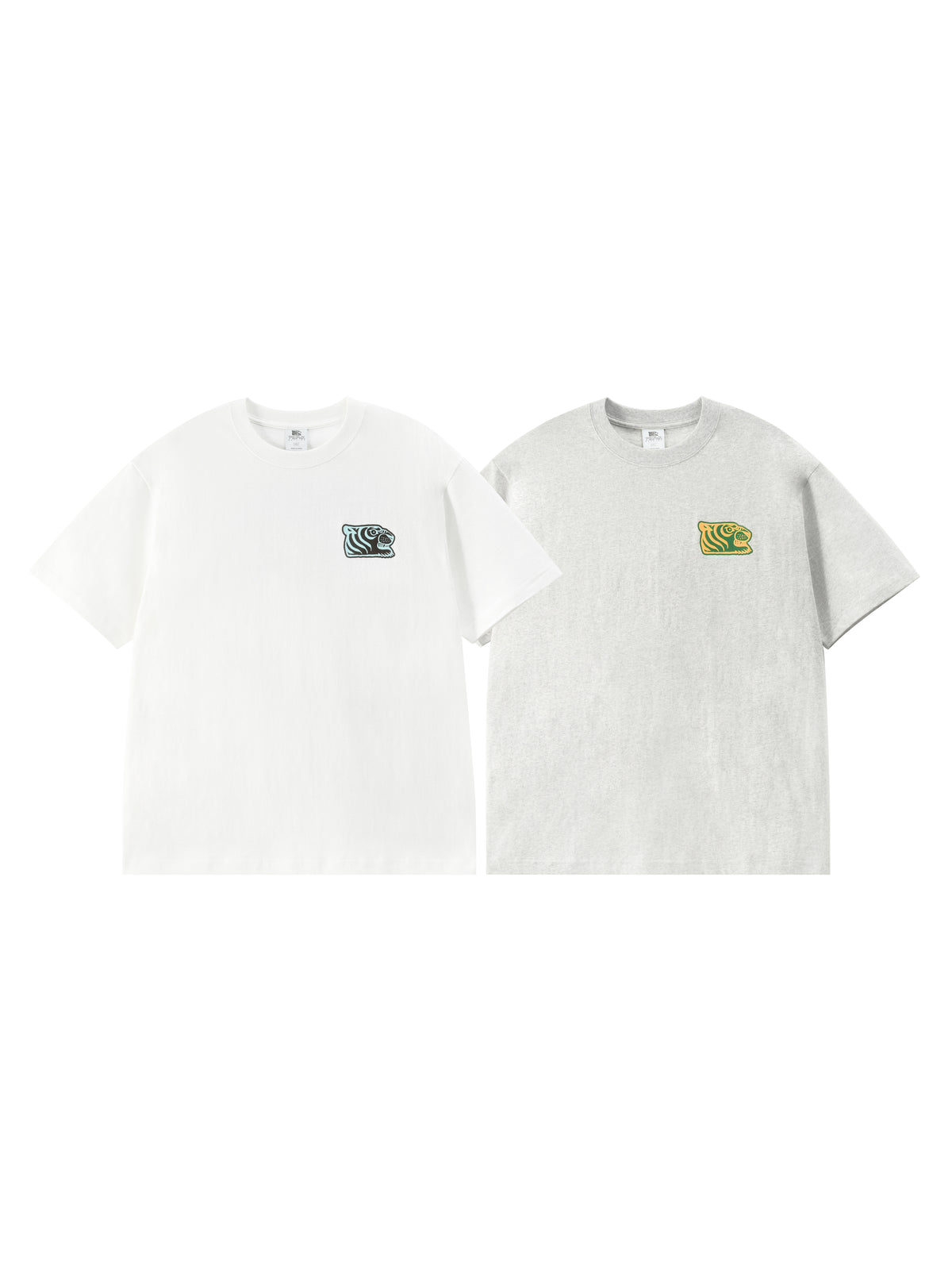 Two short-sleeve crewneck t-shirts displayed side-by-side on a plain white background. The left t-shirt is white with a small dark green and black graphic on the left chest.