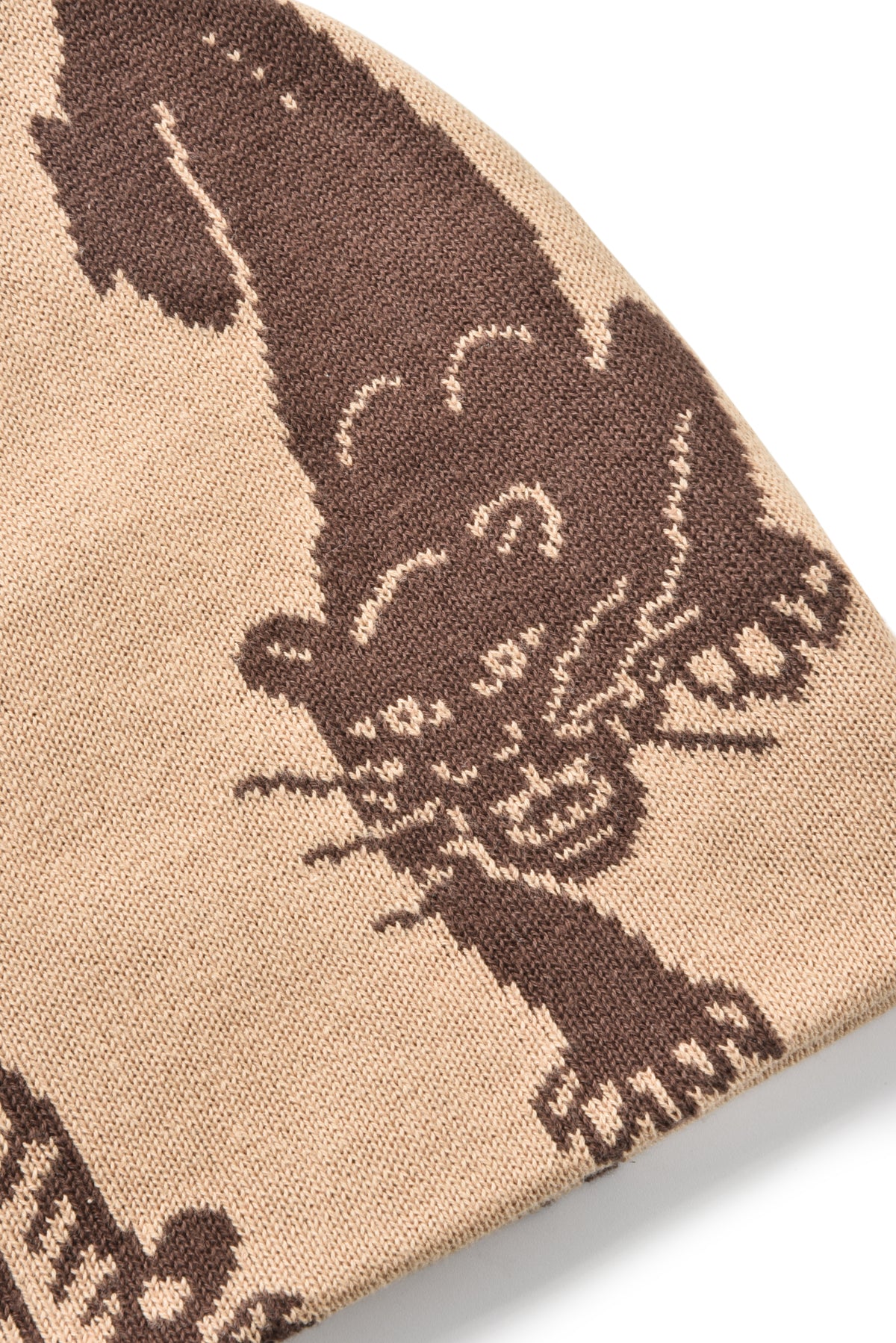 Close-up of a woven fabric with butterfly design on a beige background