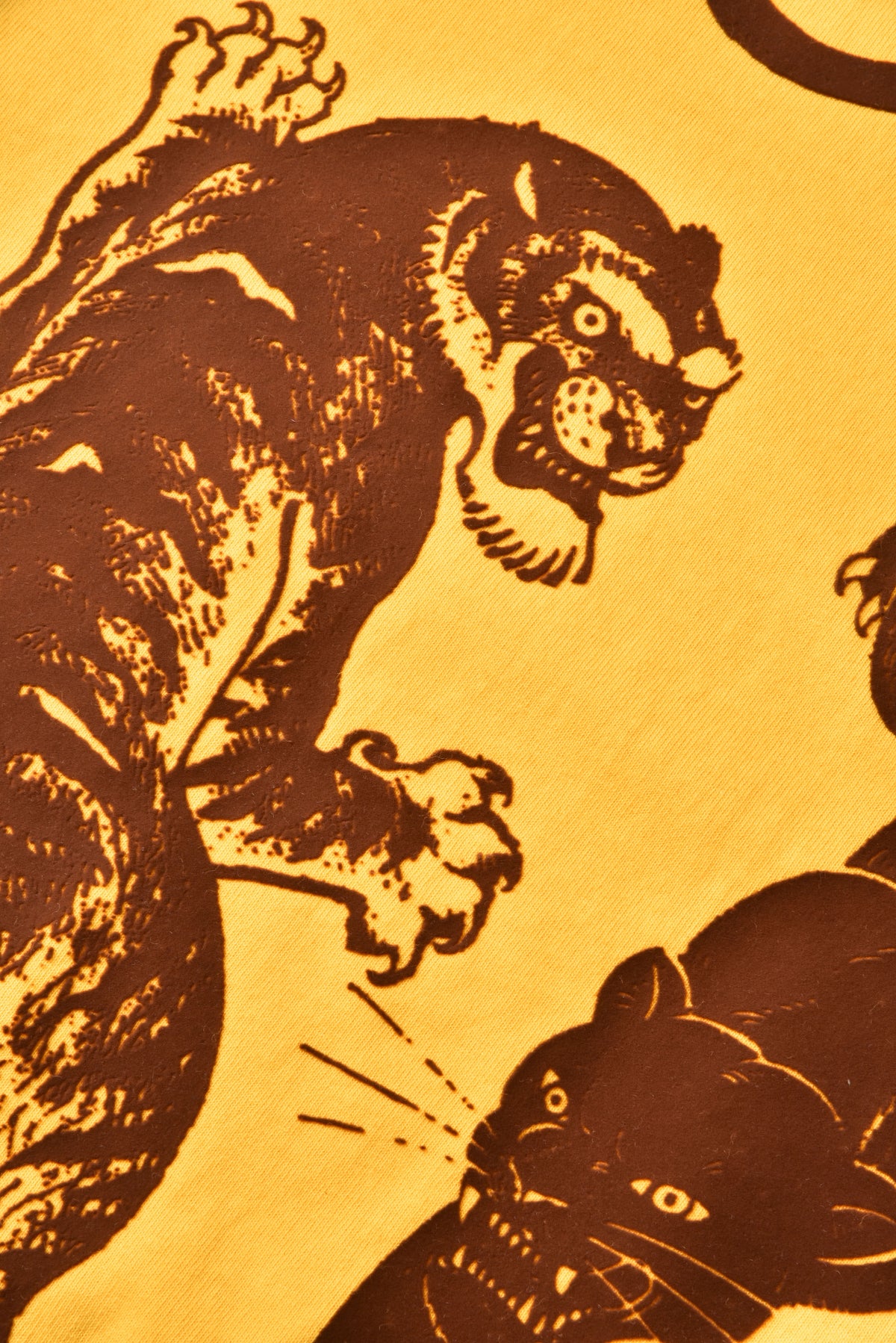 Stylized illustration of a tiger and a panther on a yellow background