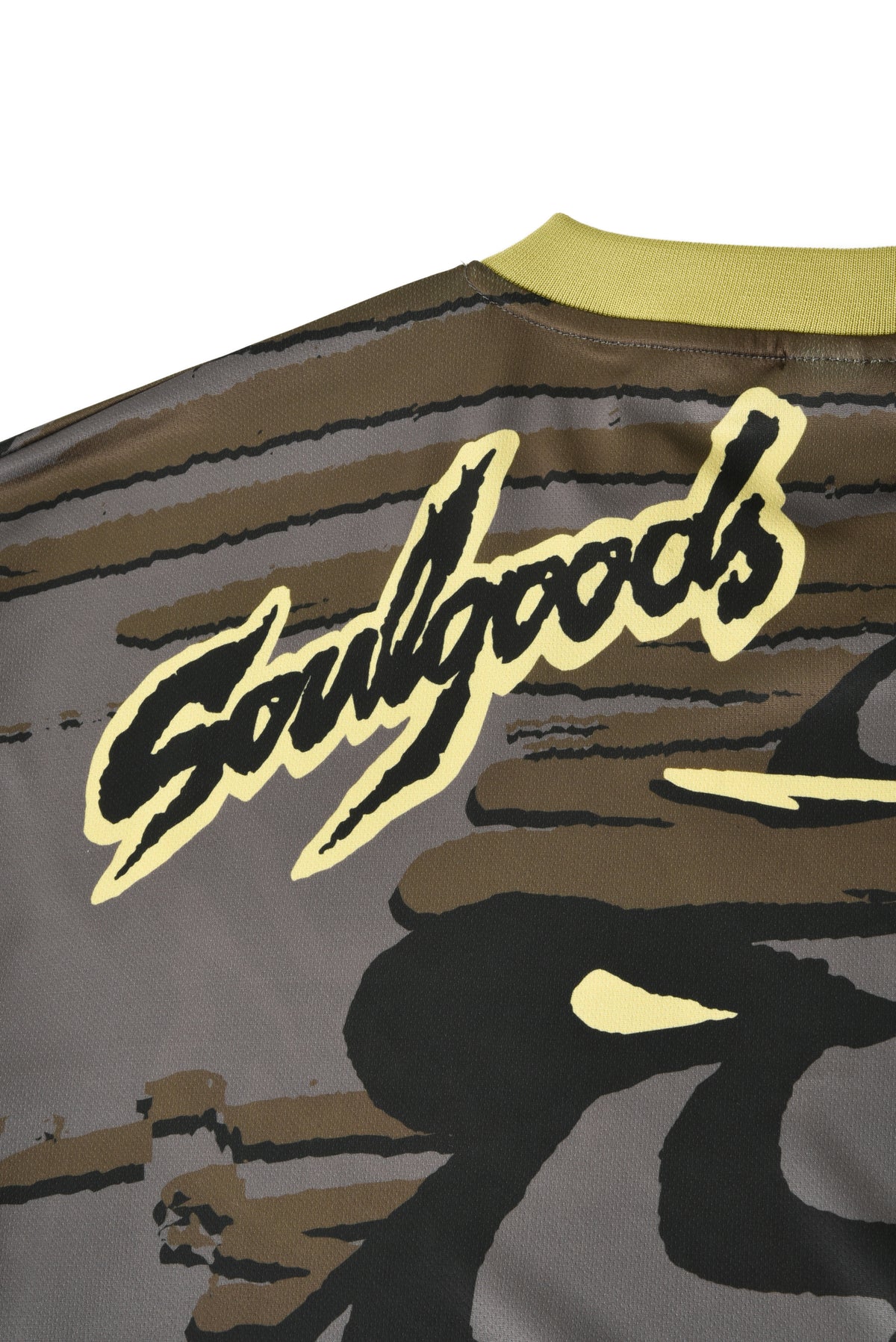Close-up of a jacket with 'Soulgoods' branding on a gray background