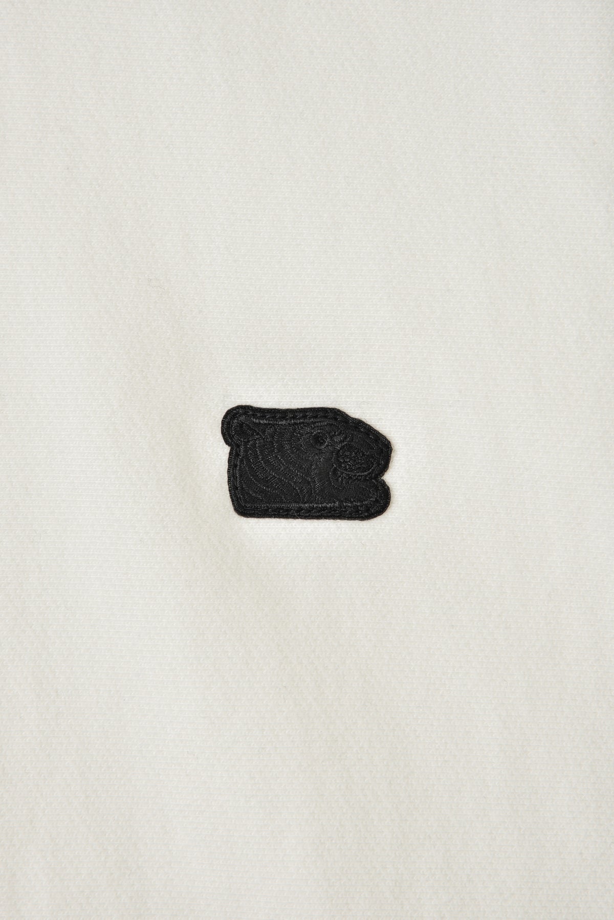 Black soulgoods tiger head patch on a white background